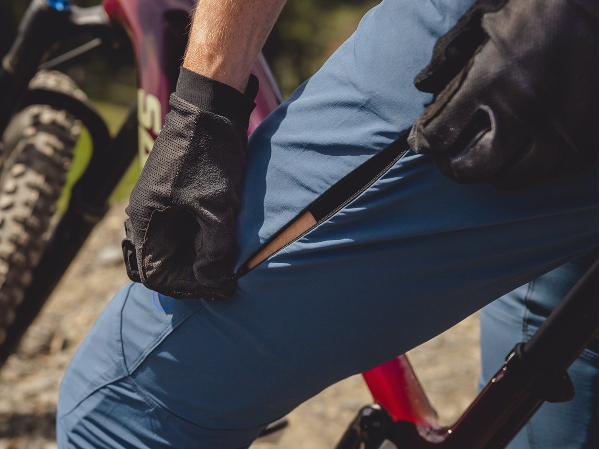 Close up of Slickrock pant zippered outer thigh vent.
