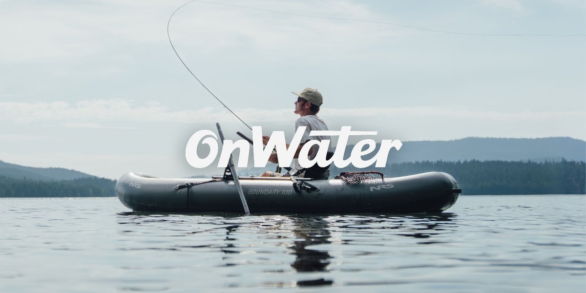 Angler fly casting from an inflatable raft on a calm lake with forested hills in the background, featuring the onWater logo.