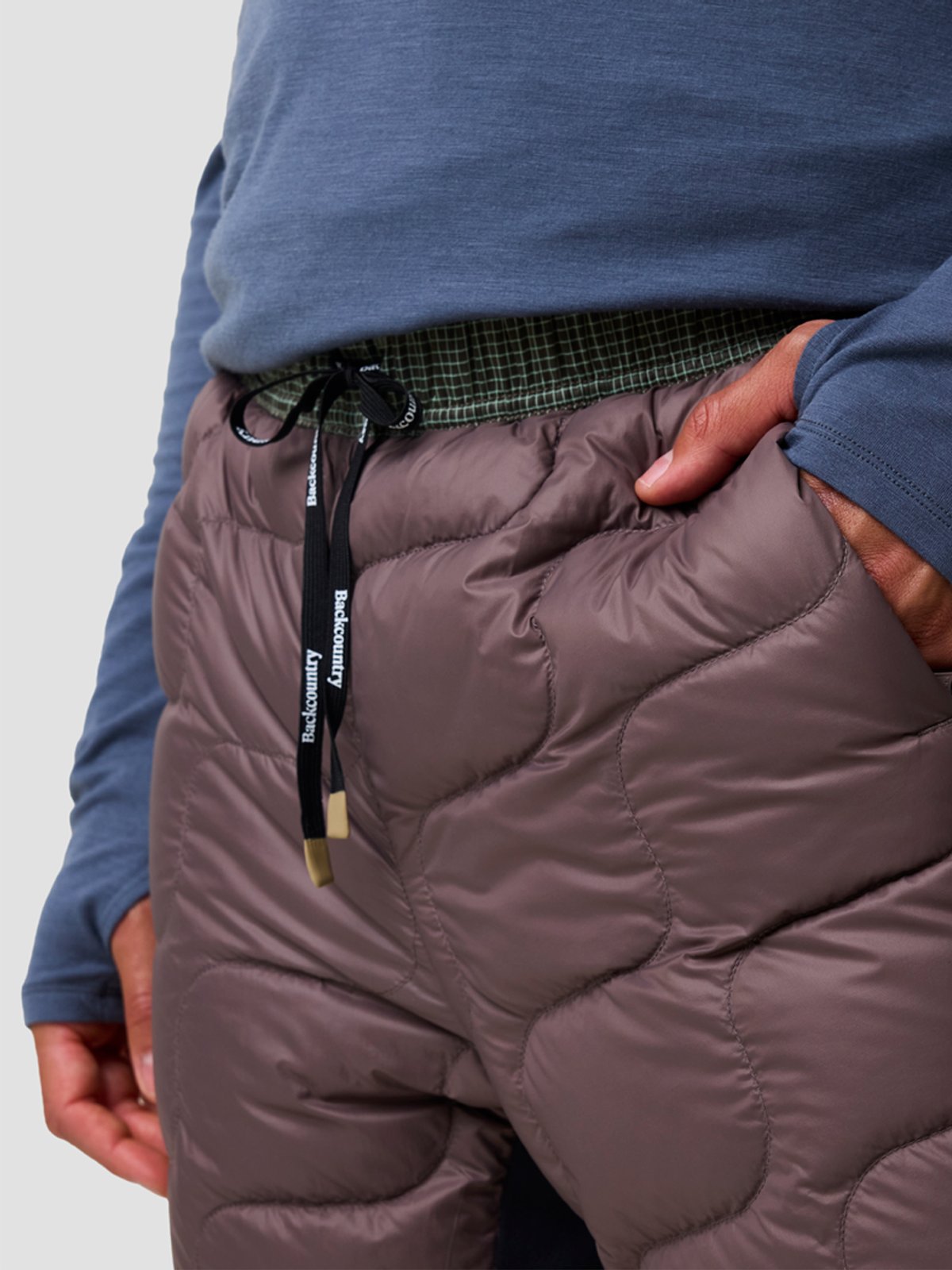 Man wears the Waas ALLIED Down pants