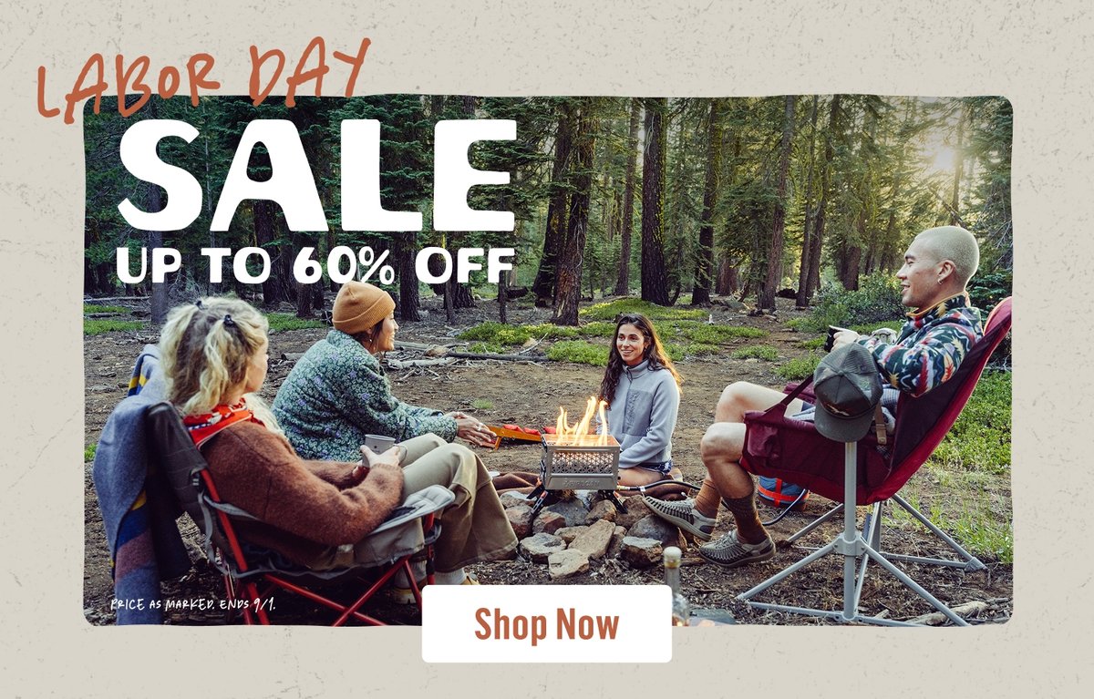 Four people sit around a campfire in the forest. The words “Labor Day Sale, Up To 60% Off” appear above them
