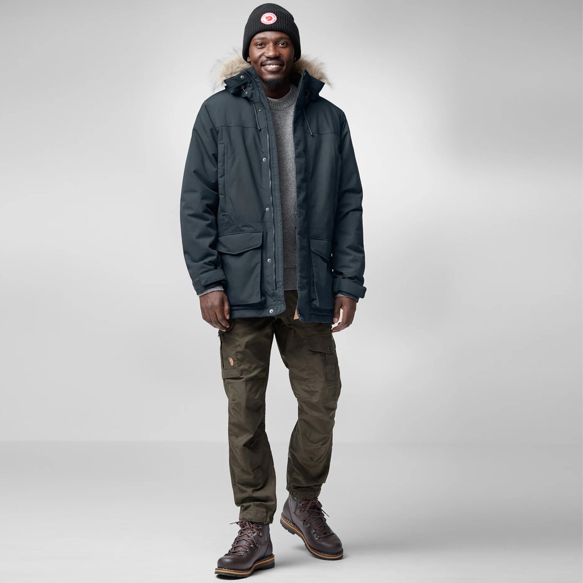 A man walks while wearing the Fjallraven Nuuk Lite.