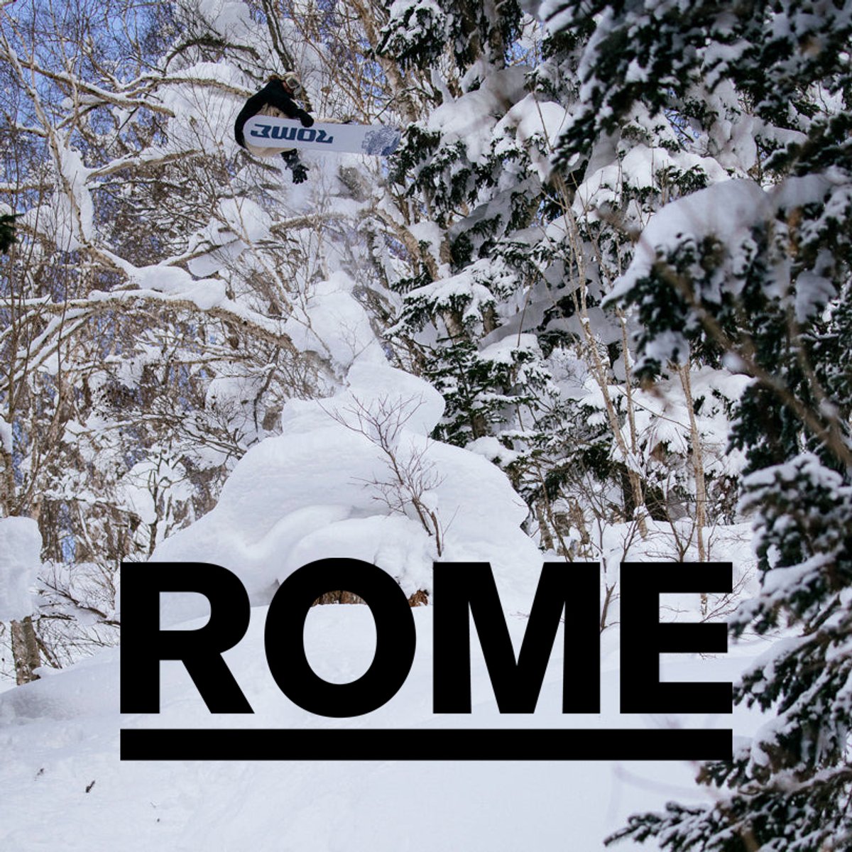 Snowboarder jumping through snowy forest with Rome snowboard and Rome logo overlay
