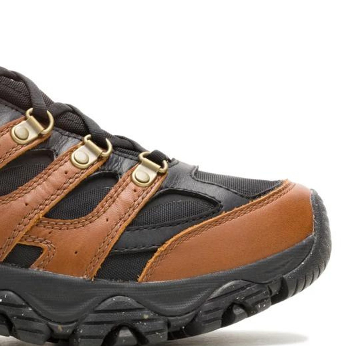 Close-up of the toe box and midsole on a Merrell hiking shoe, showing the rubber toe cap and lugged outsole.