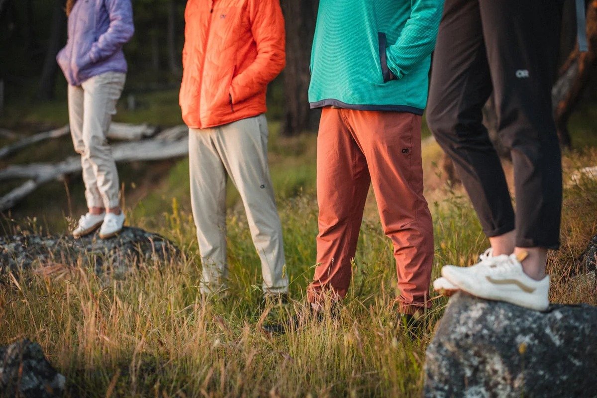 Two women walk down a hiking trail, wearing Ferrosi pants.
