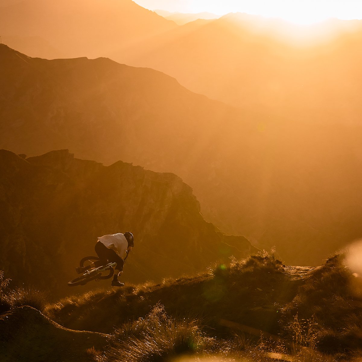 Rider getting air at golden hour sunset riding the Nomad.