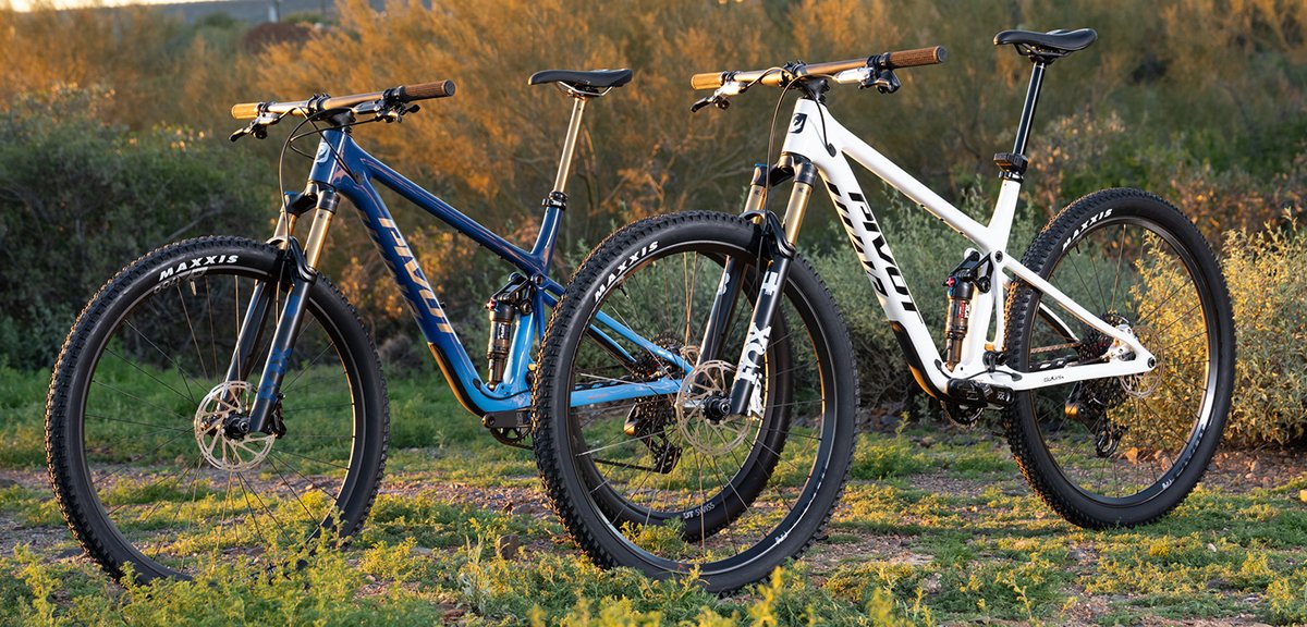 Pivot Mach 4 SL carbon cross-country mountain bike with Fox suspension and Maxxis tires on trail at sunset