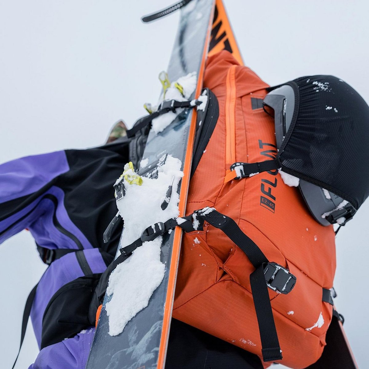BCA E2 45 avalanche airbag backpack carrying skis during backcountry ascent