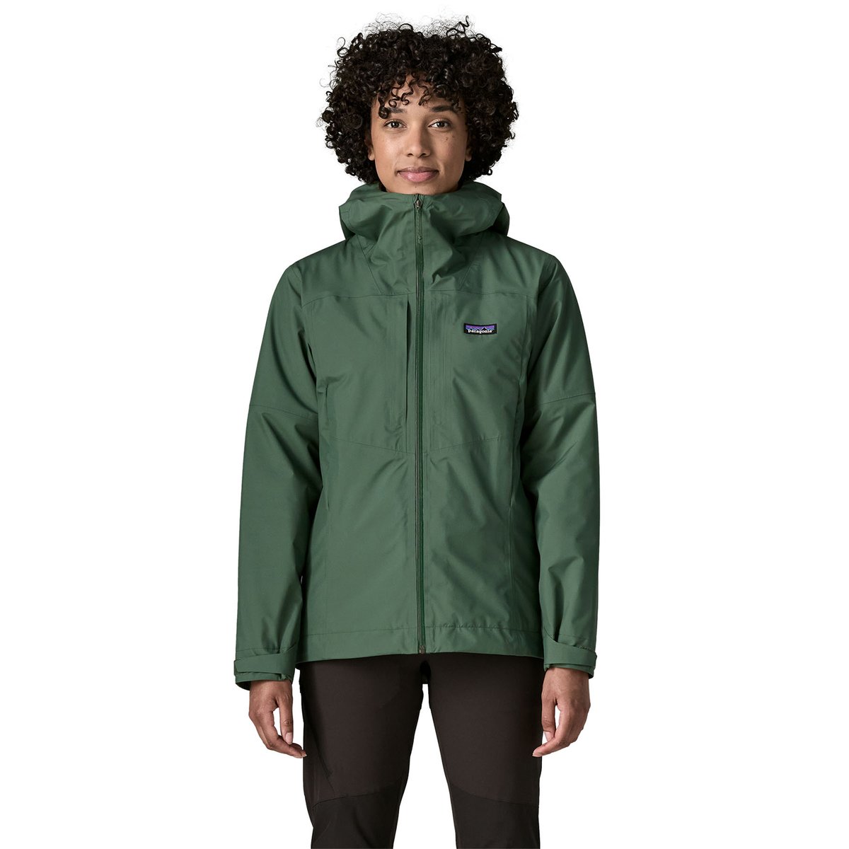 A woman wears a green Insulated Boulder Fork Rain Jacket