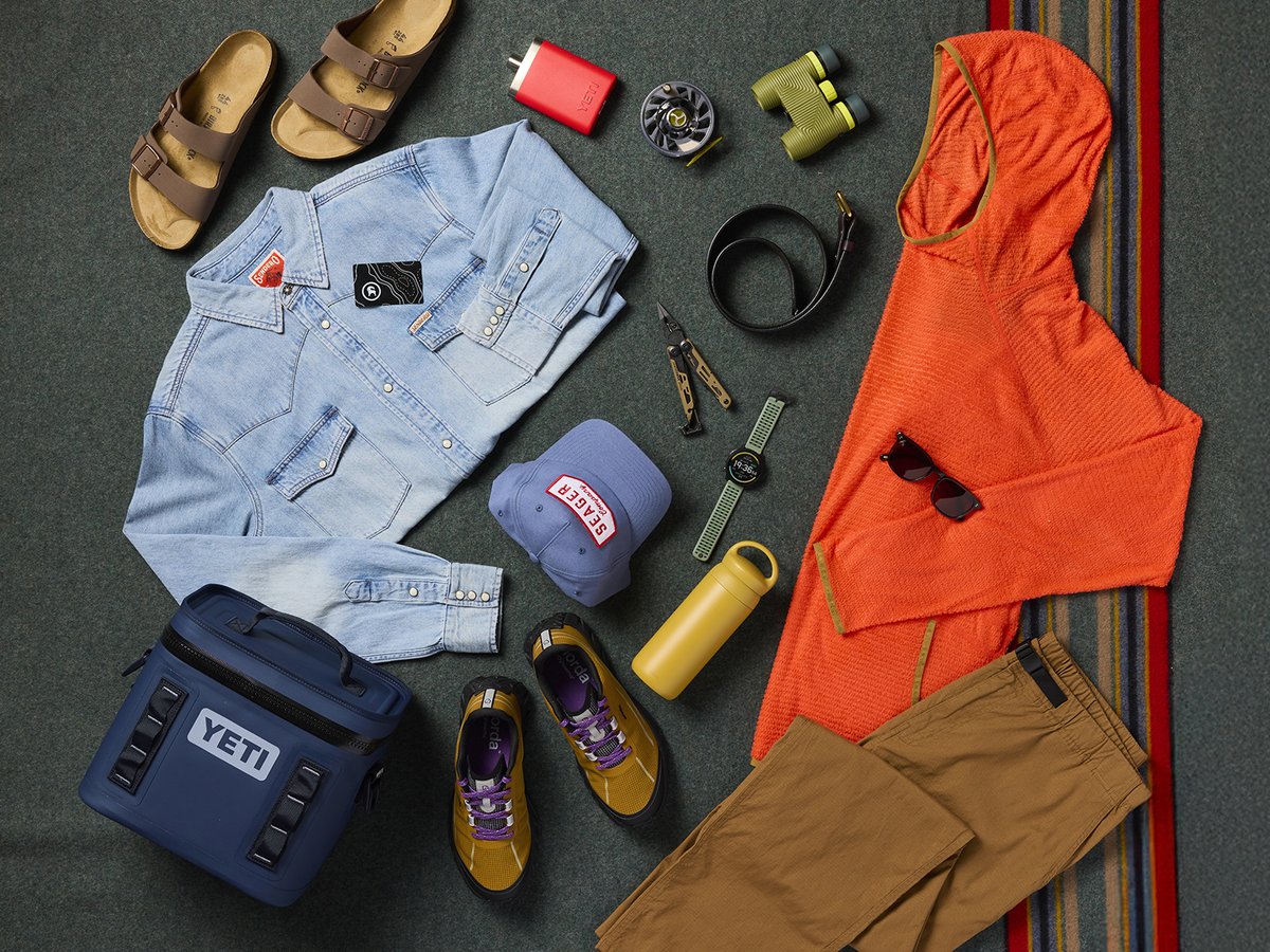 An assortment of products including a denim jacket, a Yeti cooler, and 