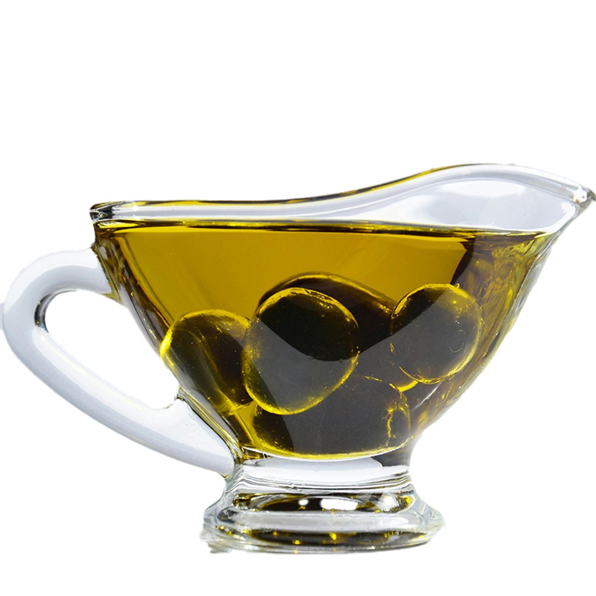A glass cup of olive oil with olives floating in it