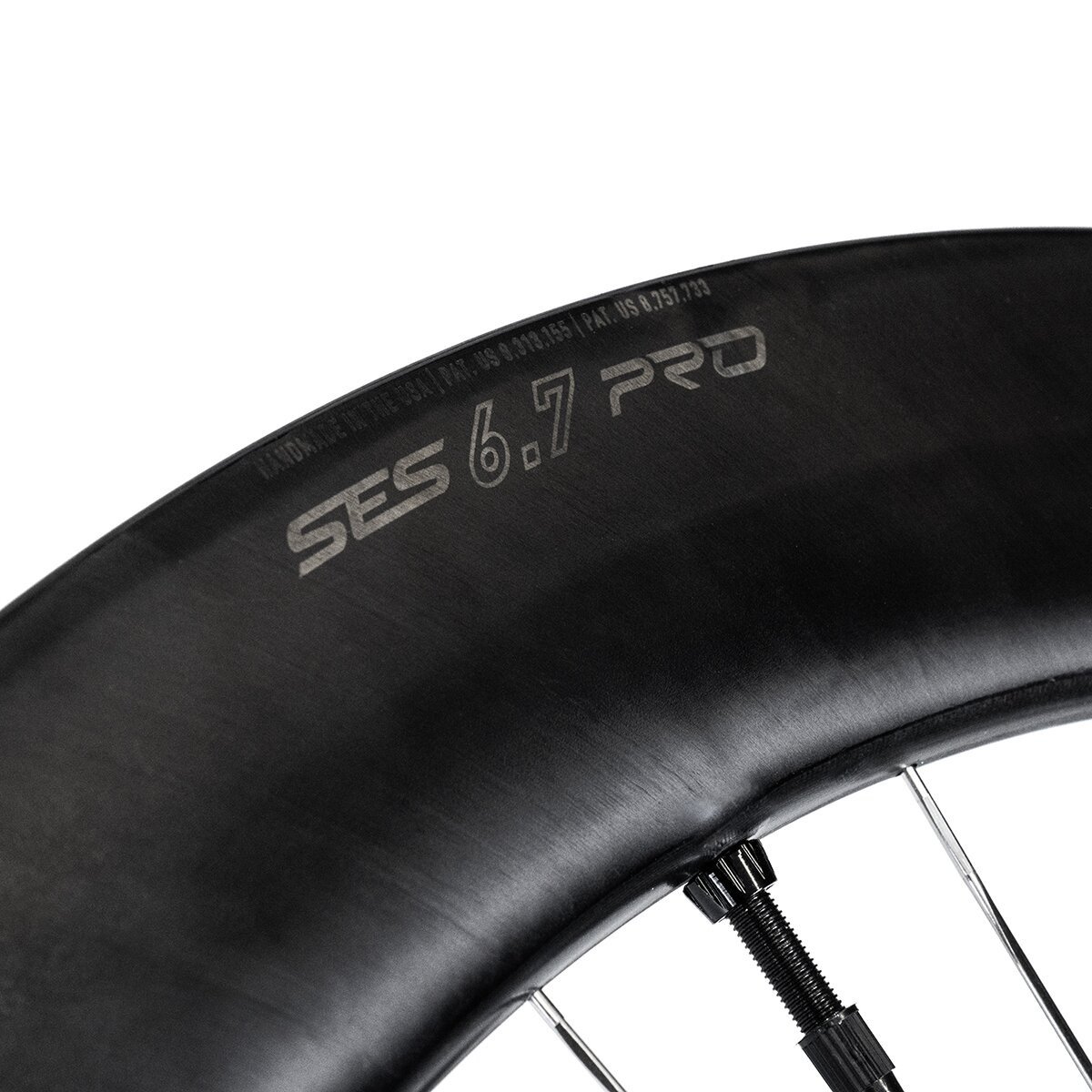 Close-up of ENVE SES 6.7 PRO rim and tire in black and silver, showing tire fit at the rim edge.
