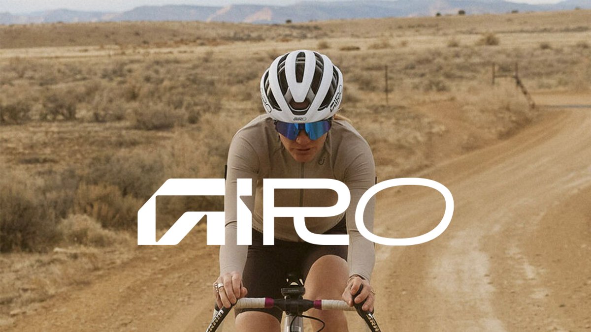 A woman rides a bike down a dirt road, with the Giro logo overlaid.