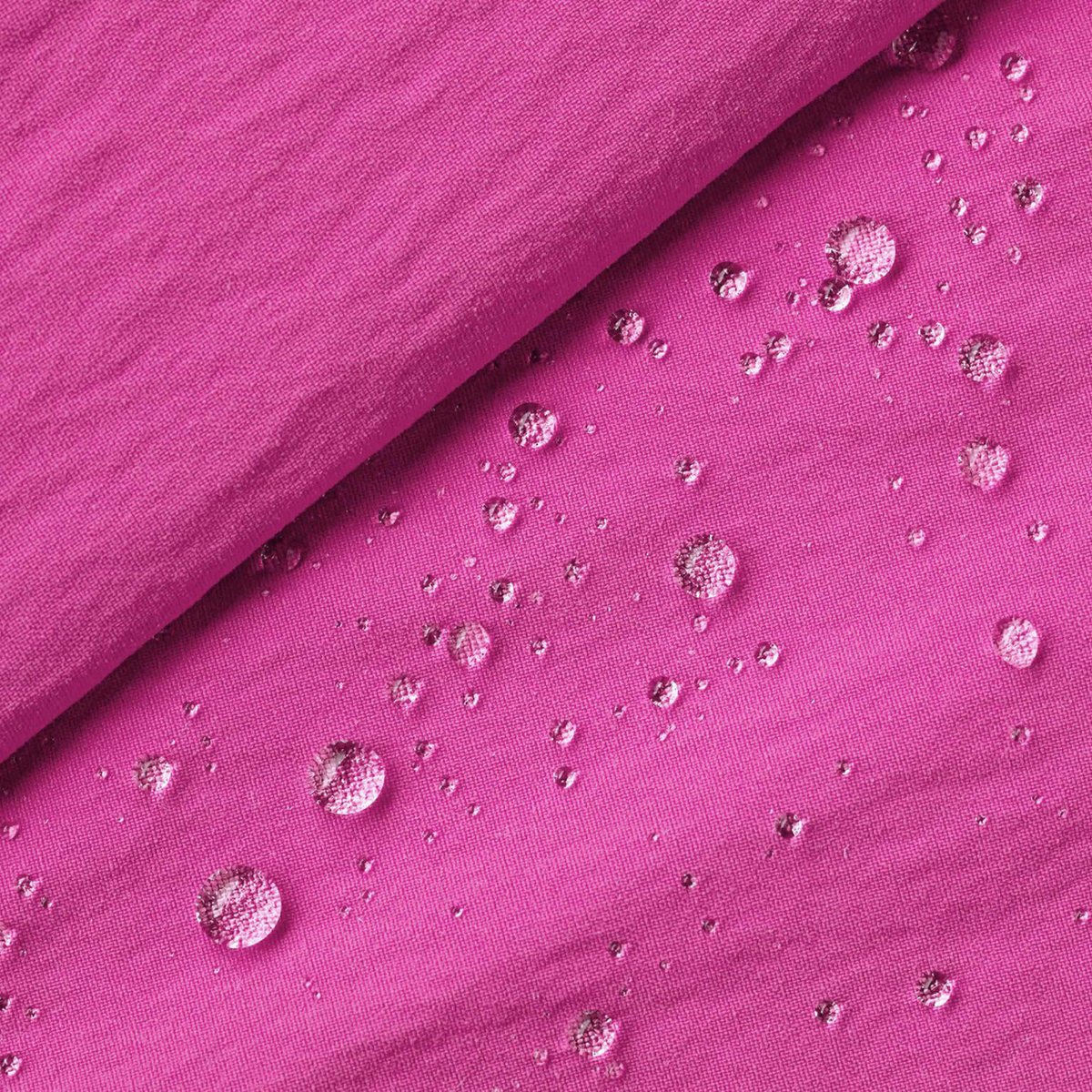 A closeup of the Baggies fabric with water beaded on it, showcasing its quick drying properties. 