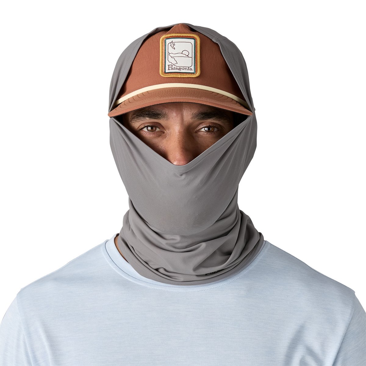 A man wearing the Patagonia Sun Mask partially over his nose and hat. 
