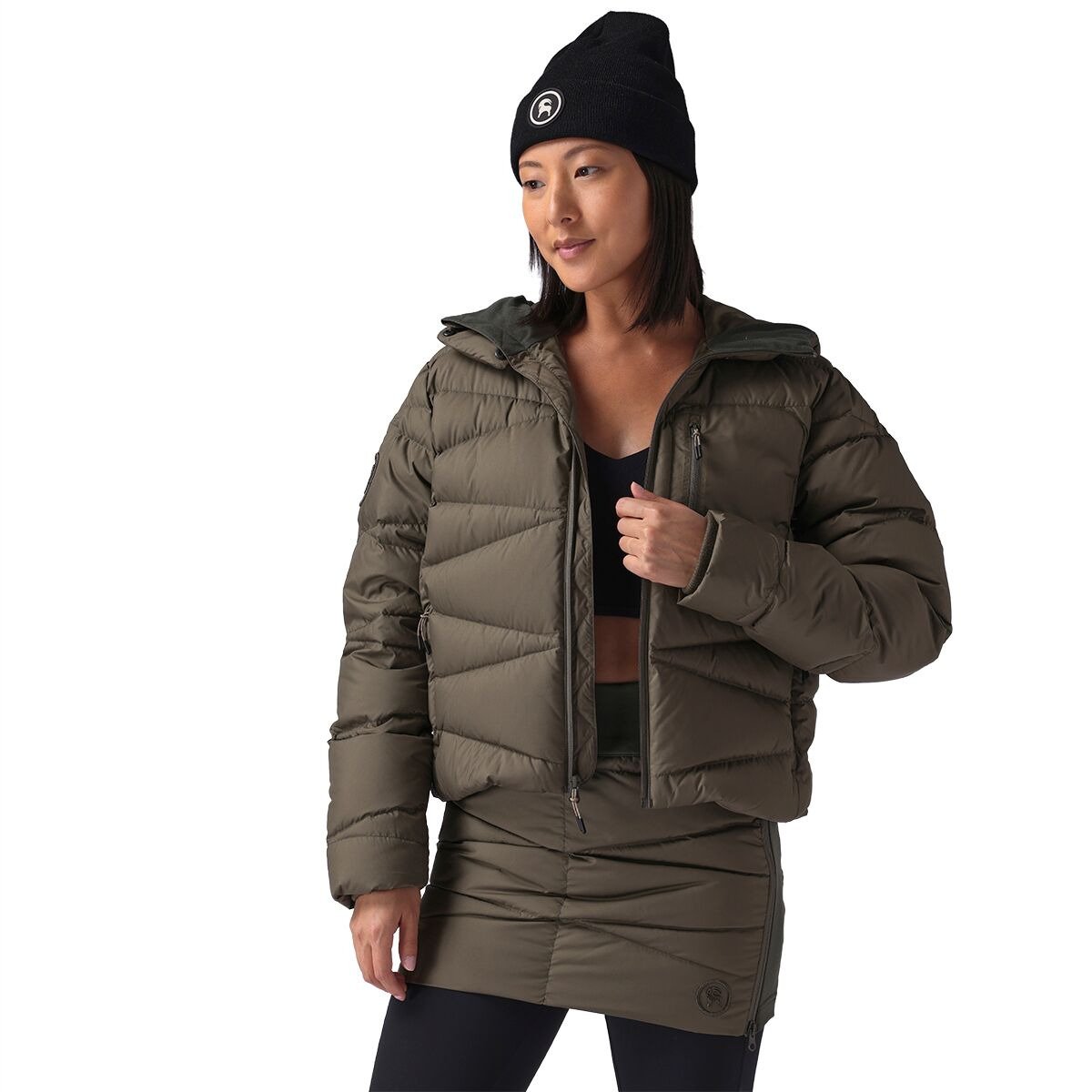 Person wearing black Backcountry beanie and Stansbury down jacket and skirt.