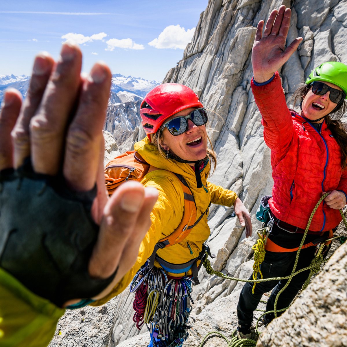 A group of climbings high five.
