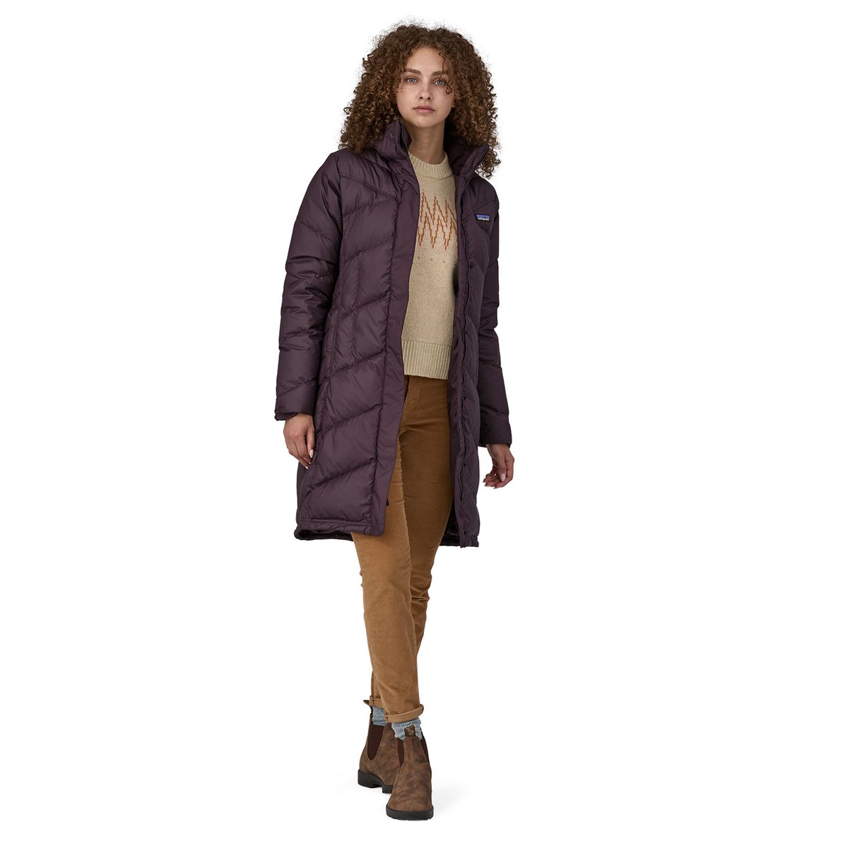 A full body shot of a woman wearing the Down With It Parka