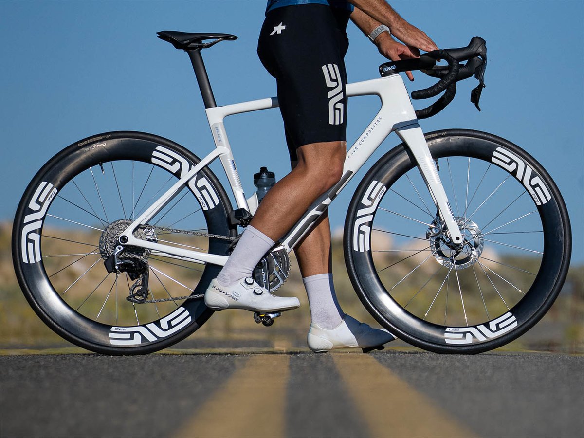 Side view of a road bike fitted with the ENVE SES 6.7 PRO wheelset, showing the carbon rims and ENVE PRO branding on both wheels.