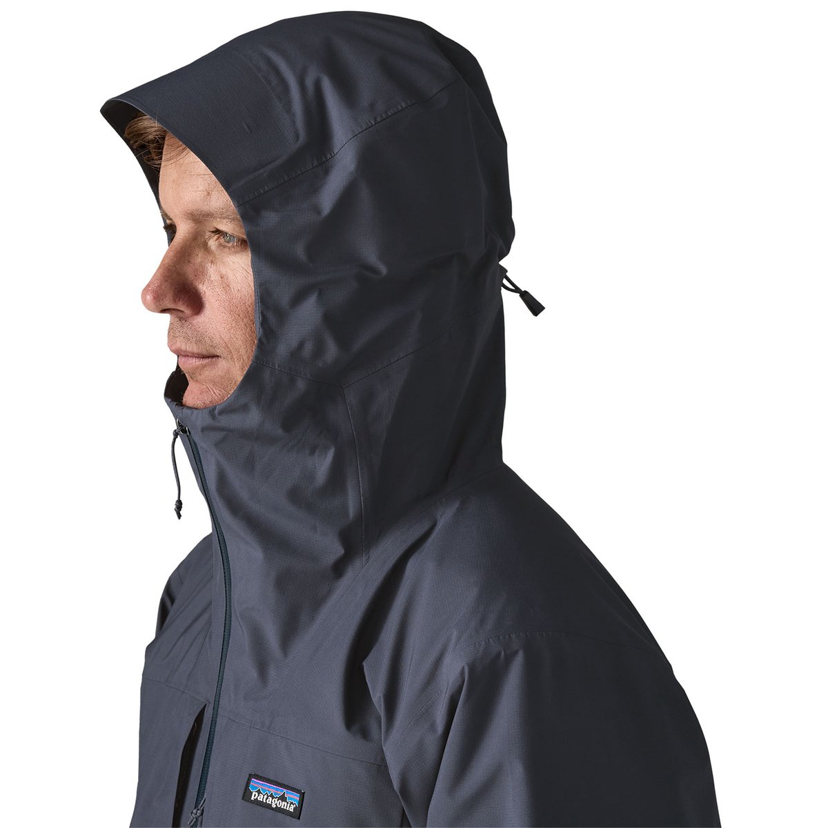 A man wears the hood of the Insulated Boulder Fork Rain Jacket