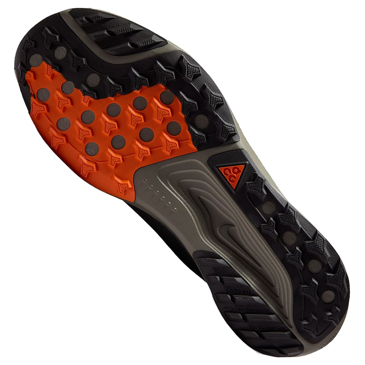 Outsole of the Nike ACG Pegasus Trail GTX showing black lugged trail traction with an orange forefoot pod and ACG logo.