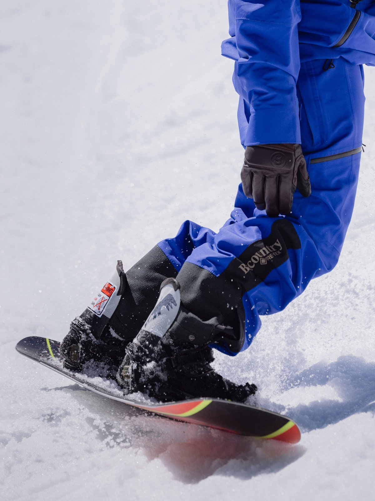 A rider toe-slides on corn snow. 