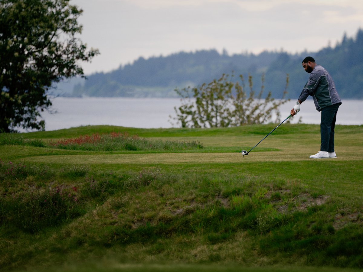 A man gets ready to tee off.