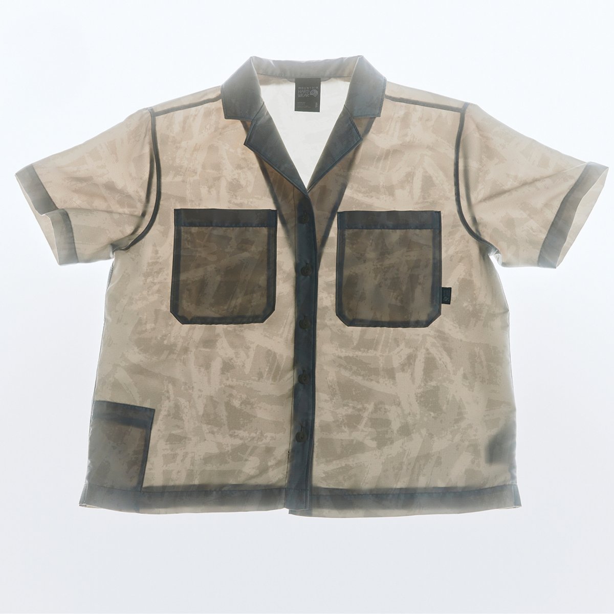 A button down shirt with light shining through it, highlighting the coolness of the fabric.