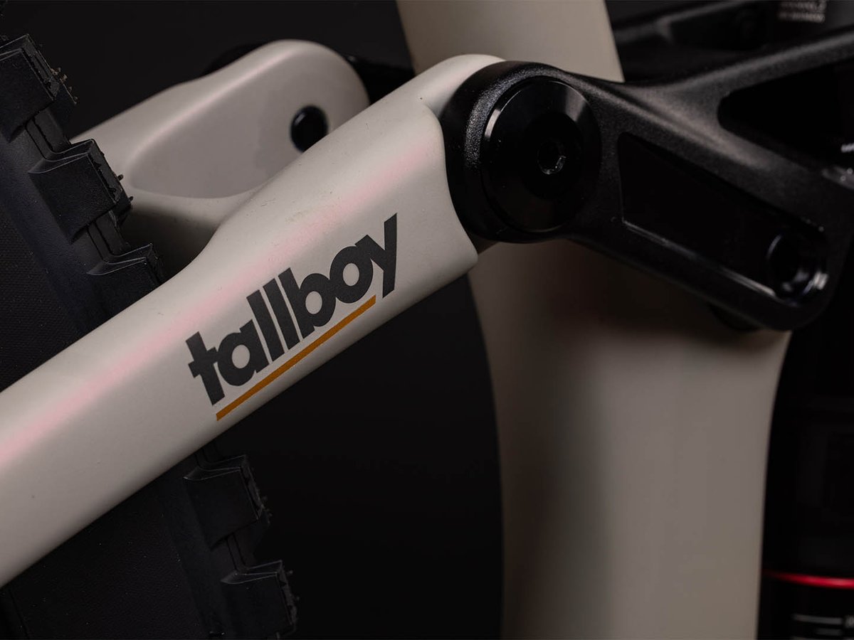 Detail of the Santa Cruz Tallboy's VPfree four-bar suspension linkage, showing the pivot points connecting the rear triangle to the carbon frame alongside rear shock.