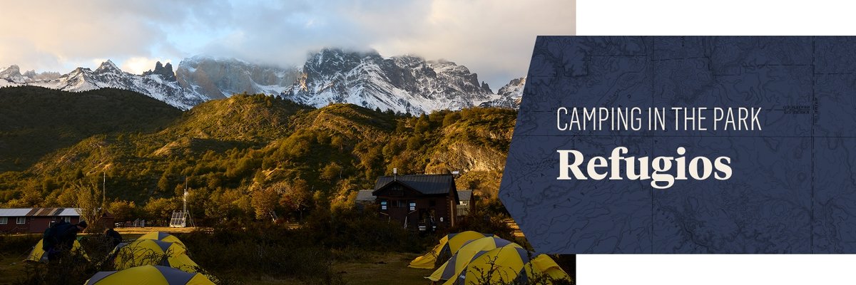 A small village sits below large, snowy mountains. The words, Camping in the Park, Refugios” appears in a box to the right of the image.