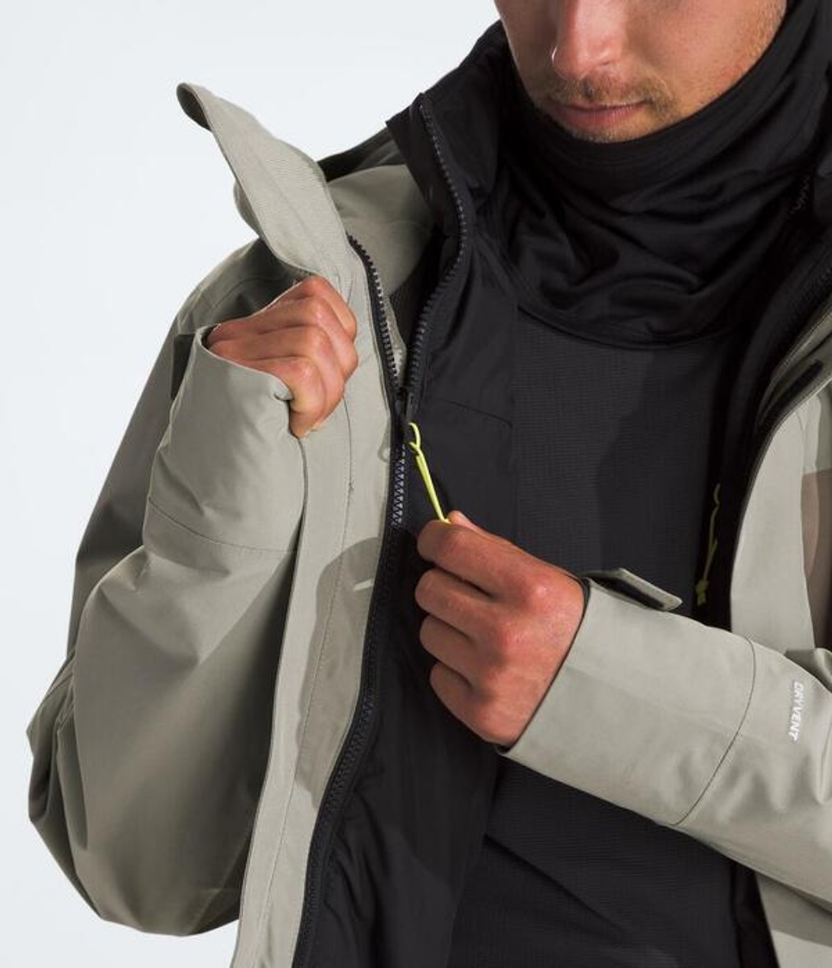 Person unzipping internal layer fro outer shell.