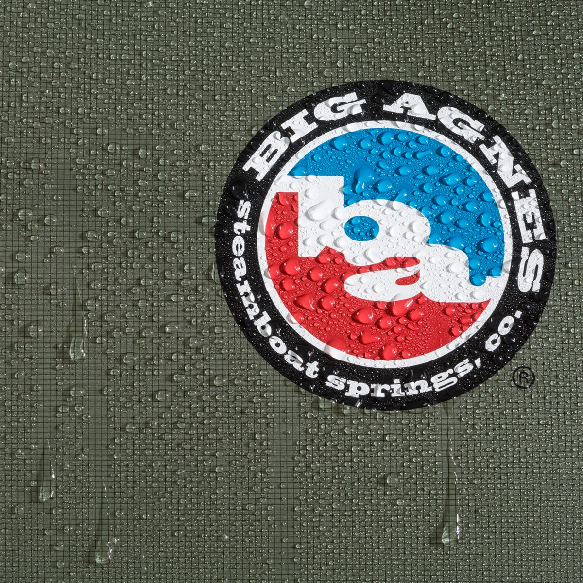 A closeup of water beading on the surface of HyperBead fabric