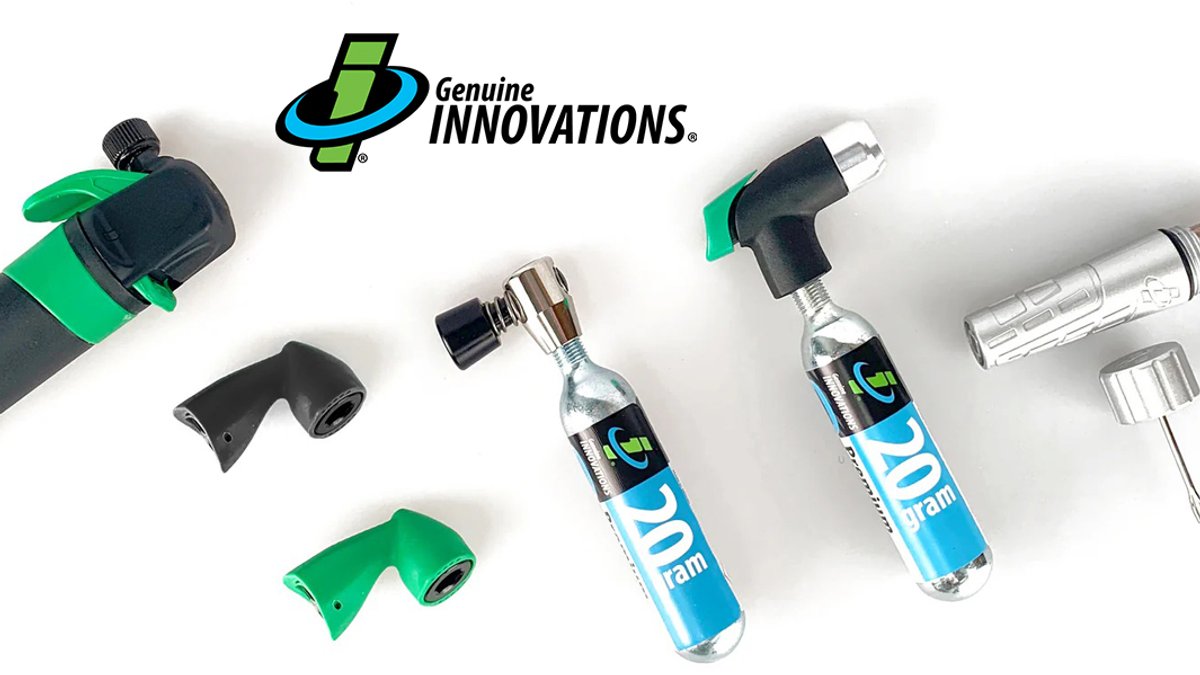 Genuine Innovations bike tire repair kit components including CO2 cartridges, valve heads, and inflation tools displayed on white background.