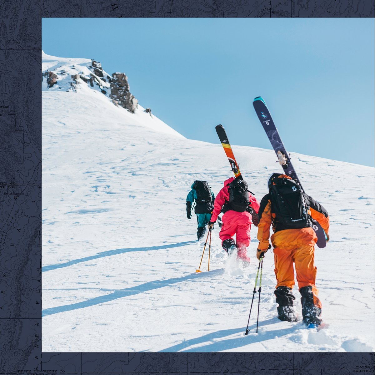 Three people wearing bright ski kits and carrying skis as they hike up a snowy mountain under a clear blue sky. Large white text on the left reads "Ski the day" and smaller text below says "Q&A and film tour".