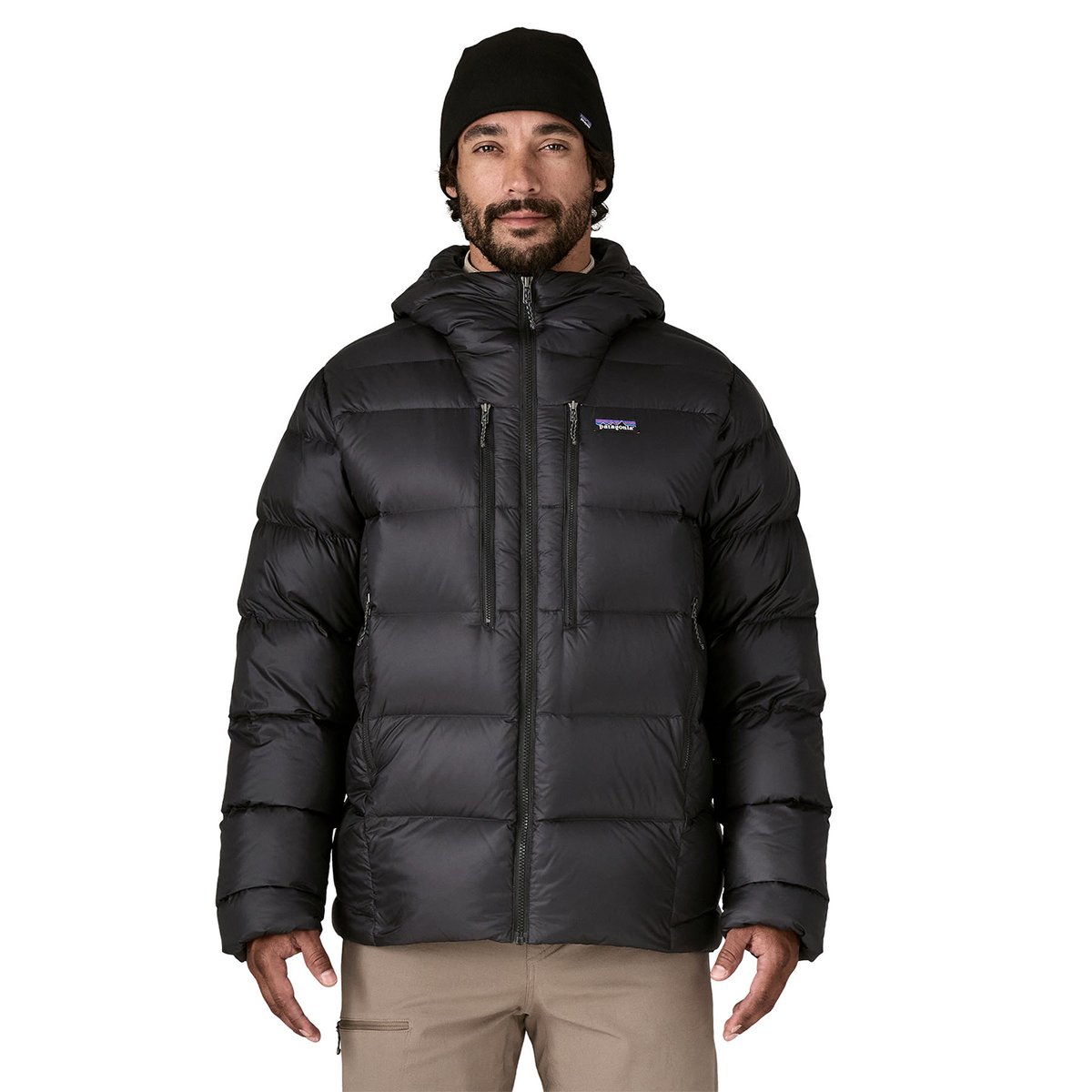 Person wearing black Fitz Roy jacket zipped up and facing forward.