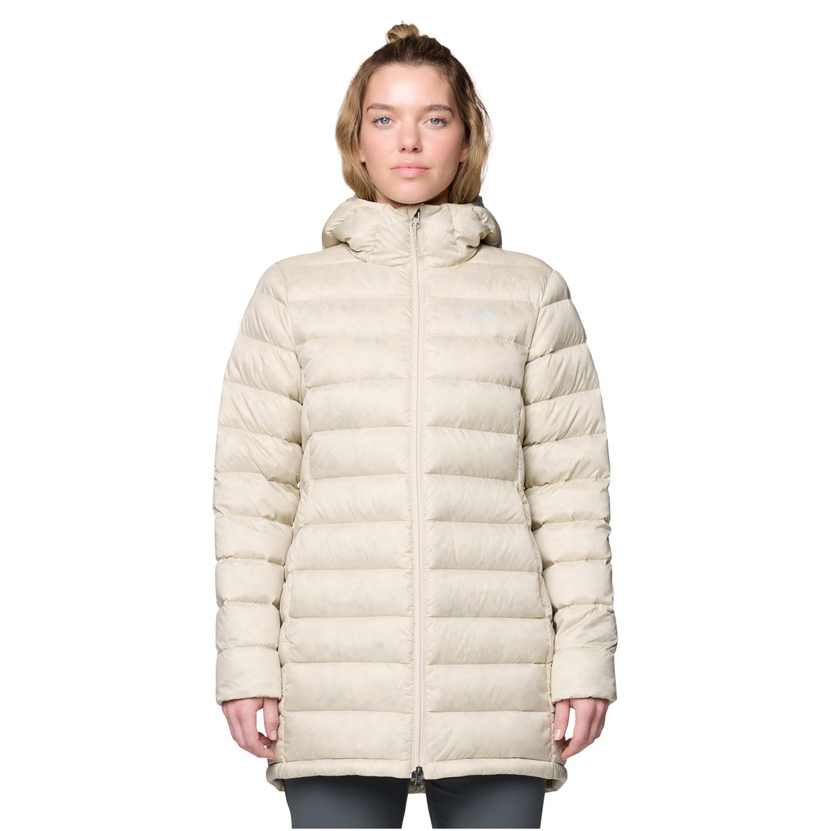 An upper body shot of a woman wearing the Tiberondack Down Parka
