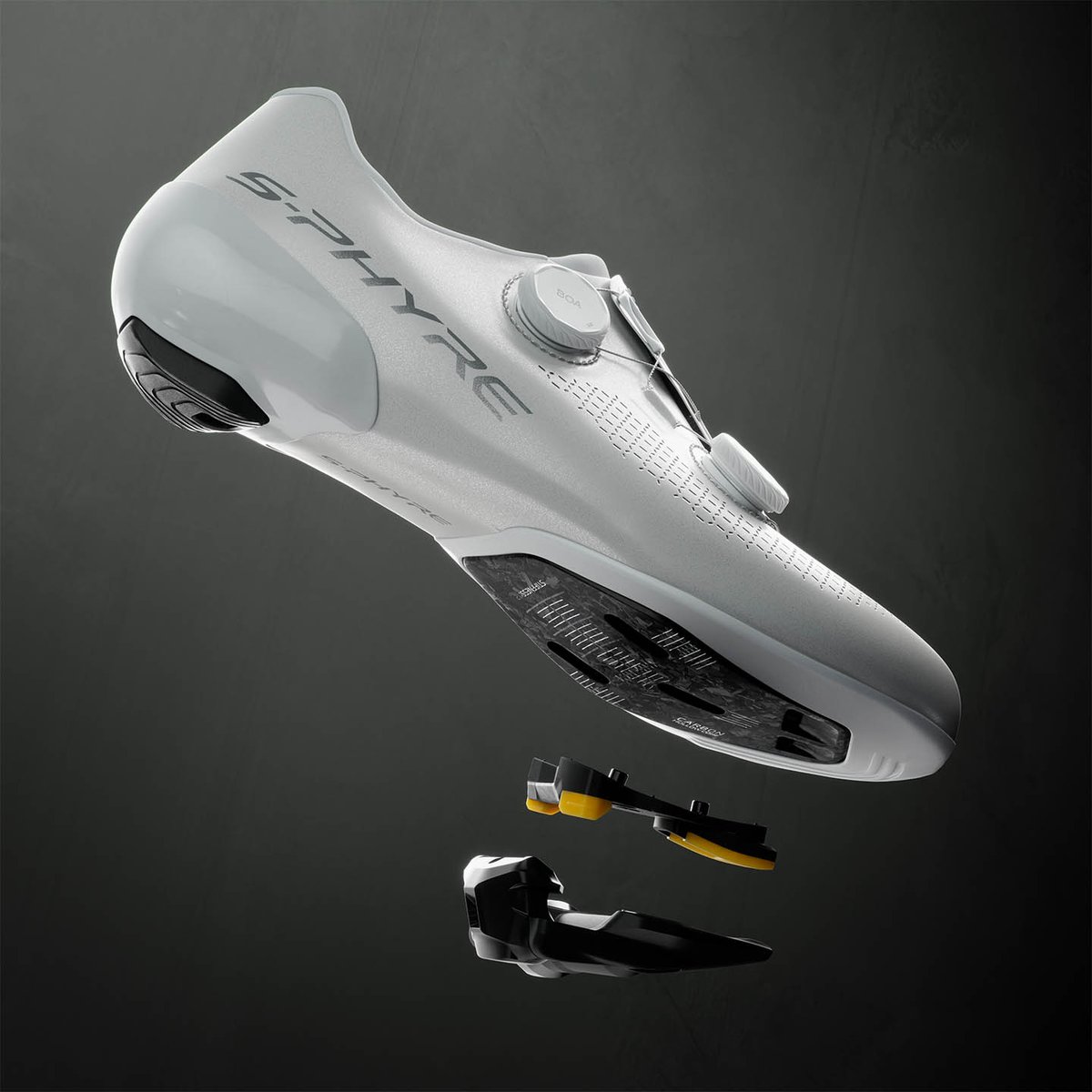 Exploded render of an S-PHYRE shoe sole with cleat and pedal separating away, glowing highlight on the interface