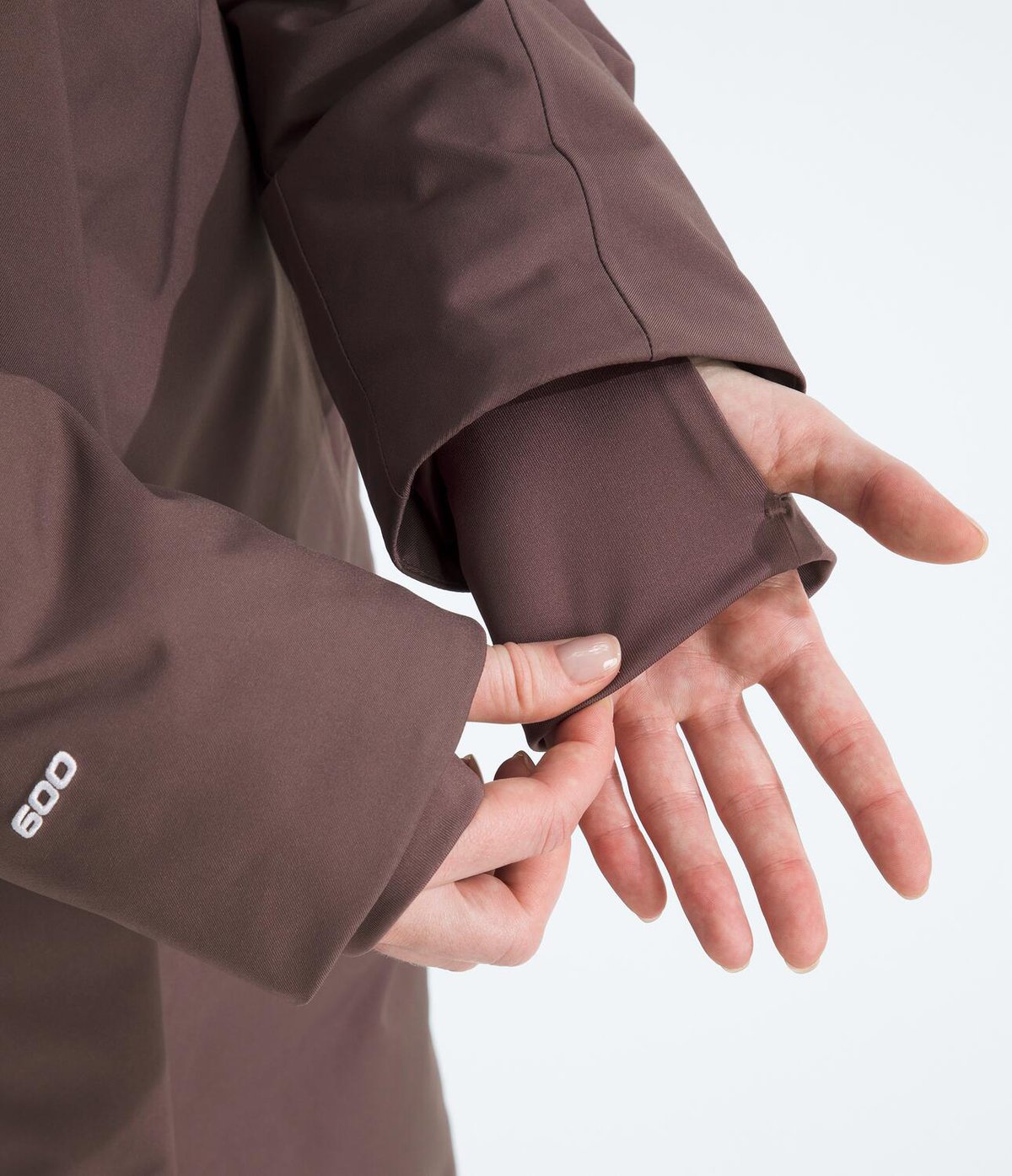 A closeup of the thumbhole details