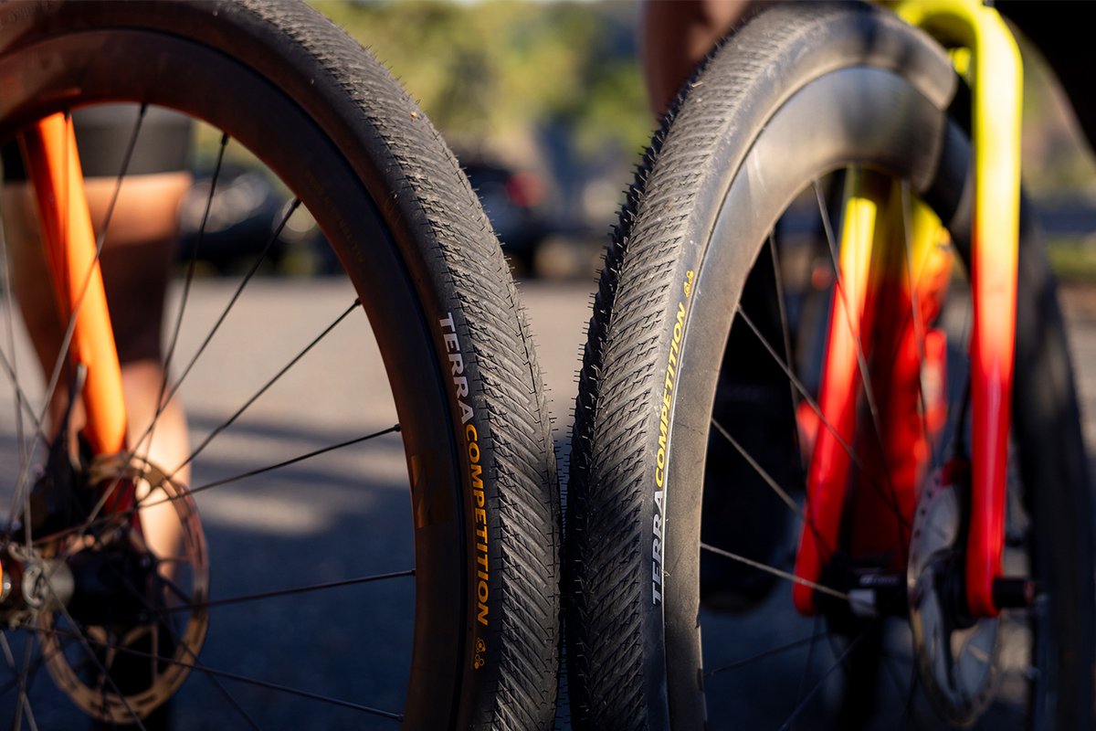 Two bike wheels leaned against eachother.