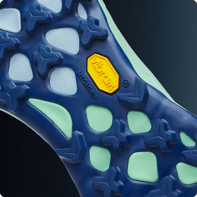 Detail of lugged sole of Merrell Agility Peak 6 trail run shoe.