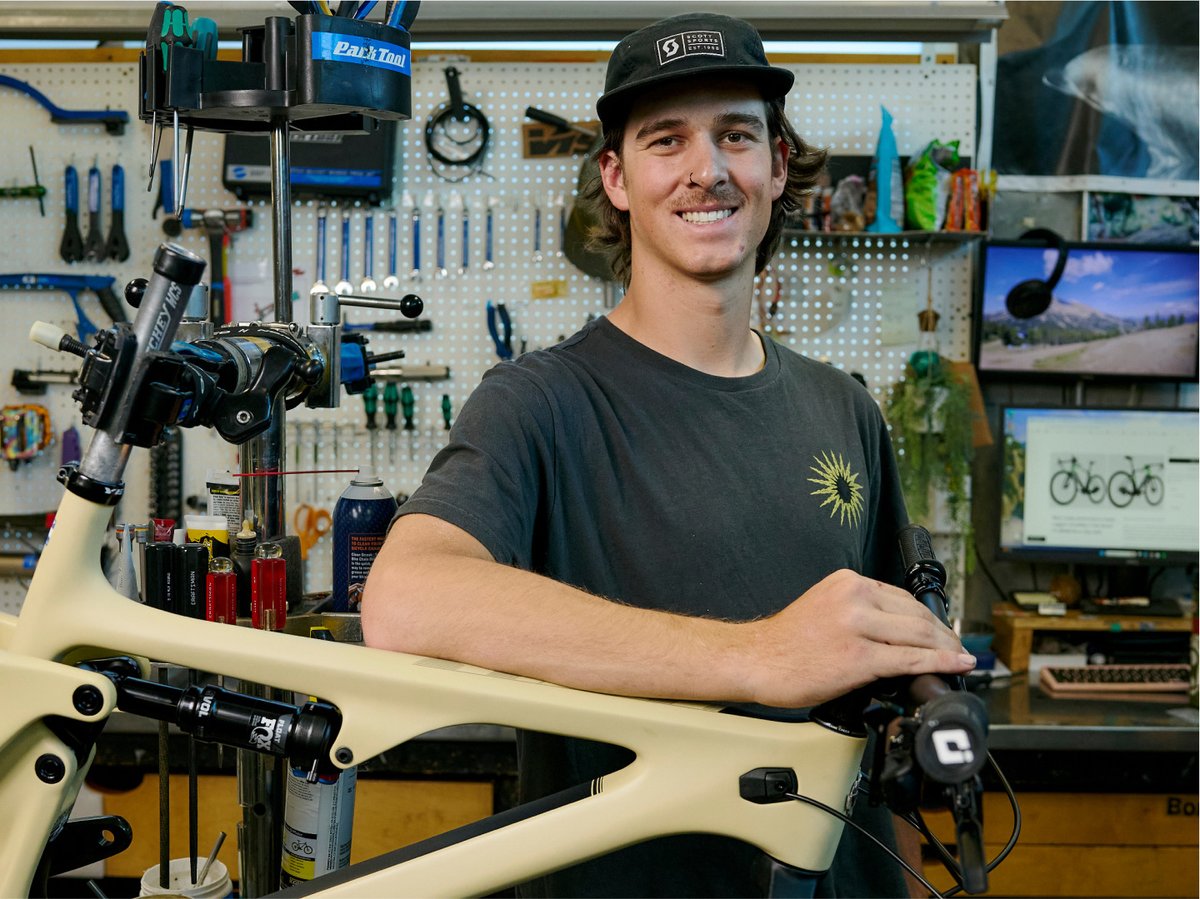 A friendly Gearhead in the garage with an e-bike.