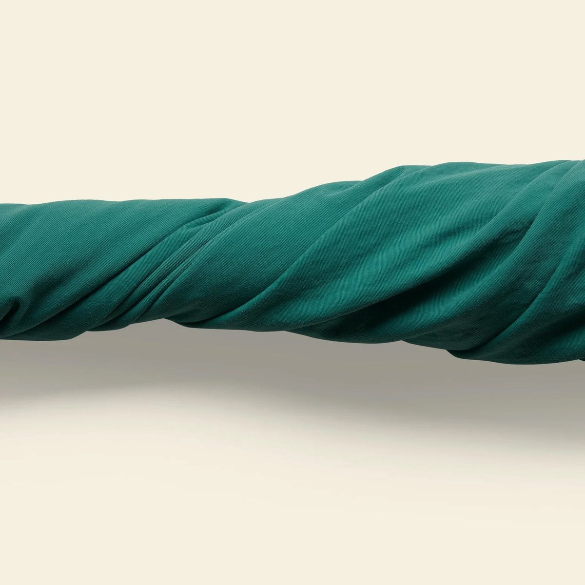 A closeup of the Baggies fabric being twisted, showcasing the durable fabric. 