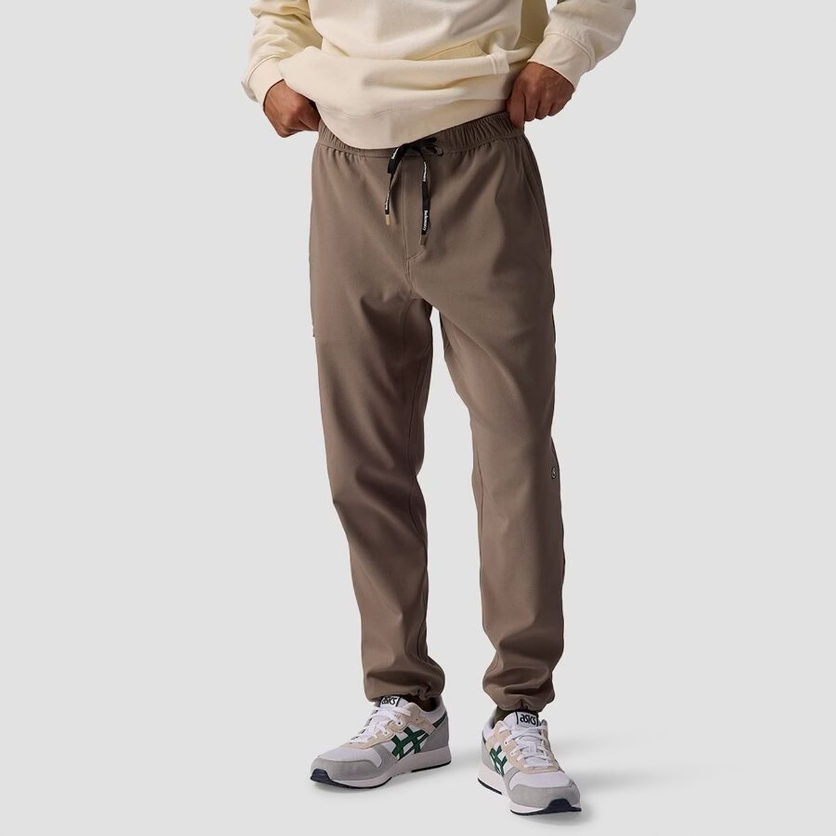 A man wears the BGA Destination Softsheel Fleece Pant.