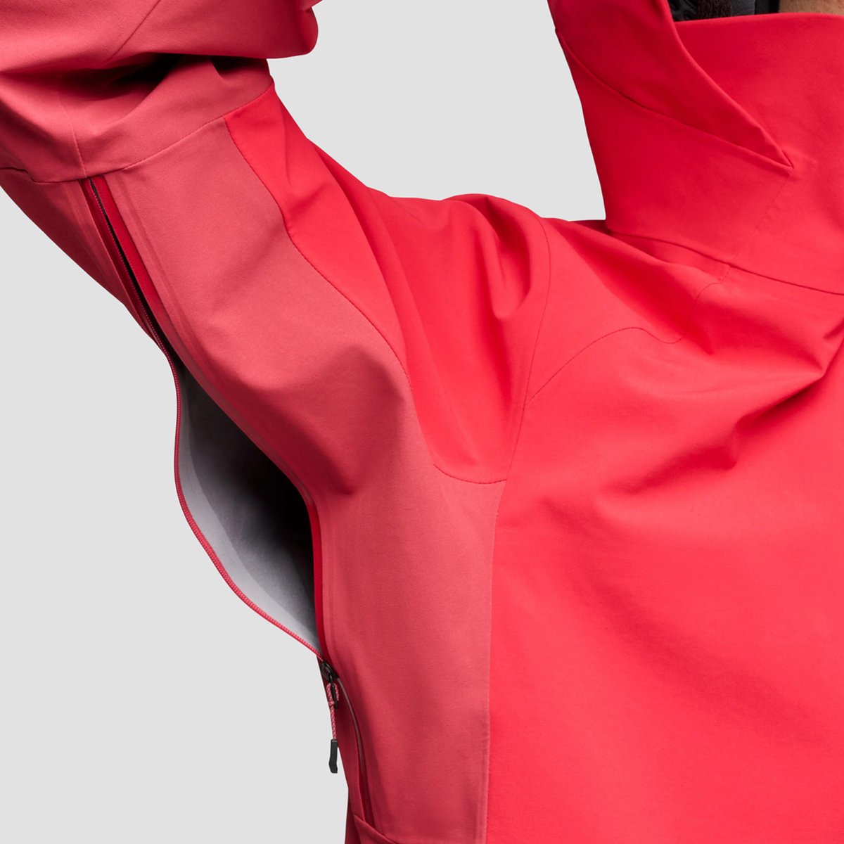 A person wearing a Black Diamond Recon jackets raises their arm, highlighting the stretch of the fabric.