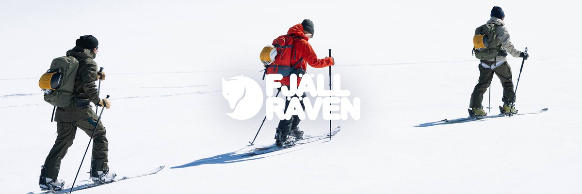 A person climbs a snowy mountain.