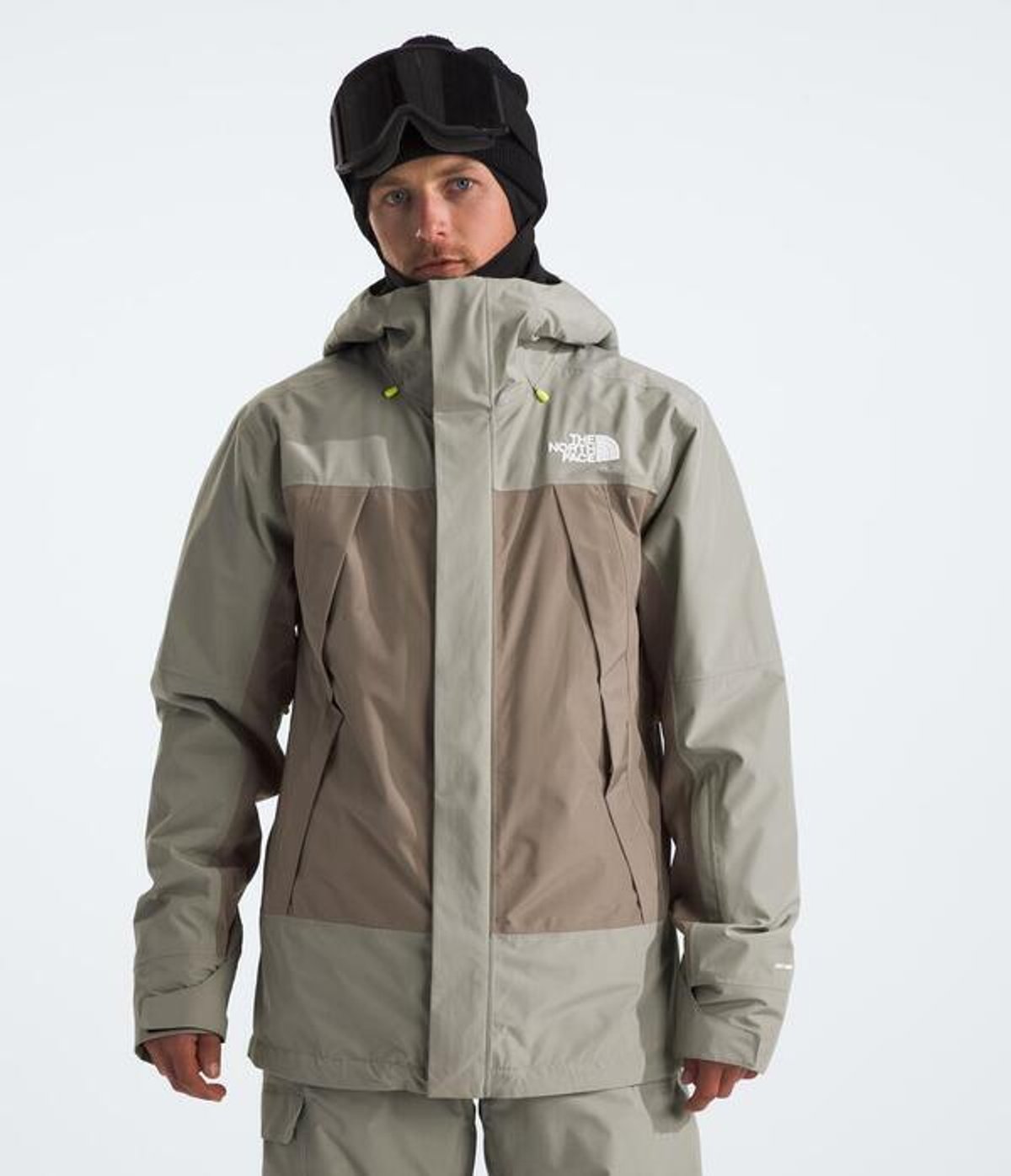 Person facing forward wearing snow jacket with hat.