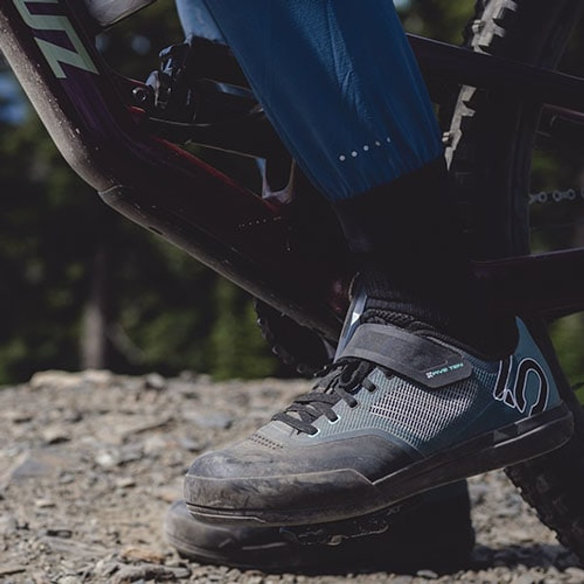 a close-up view of a rider wearing Five Ten mountain bike shoes