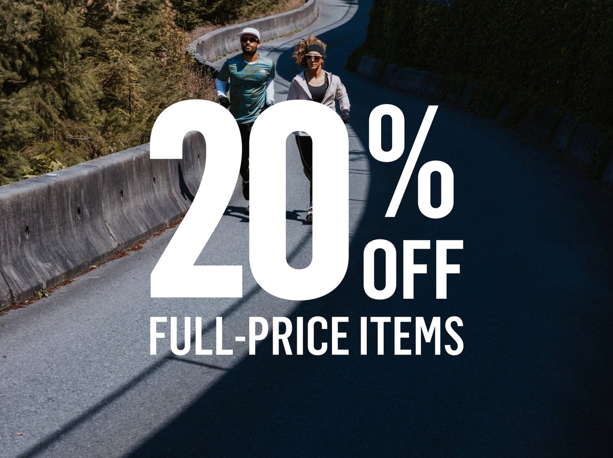 Two runners on a winding forested road. 20% off full-price items.