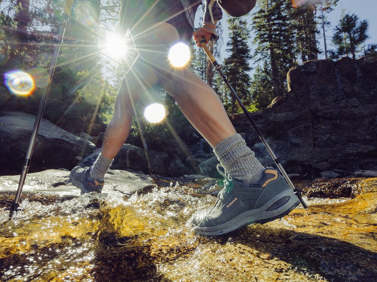 A person splashes through a creek.