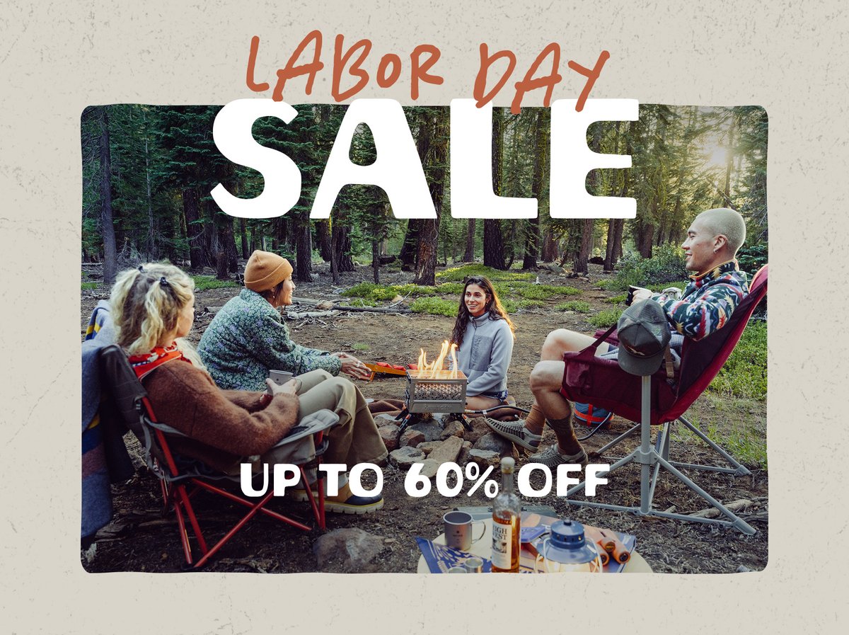 Four people sit around a campfire in the forest. The words “Labor Day Sale, Up To 60% Off” appear above them