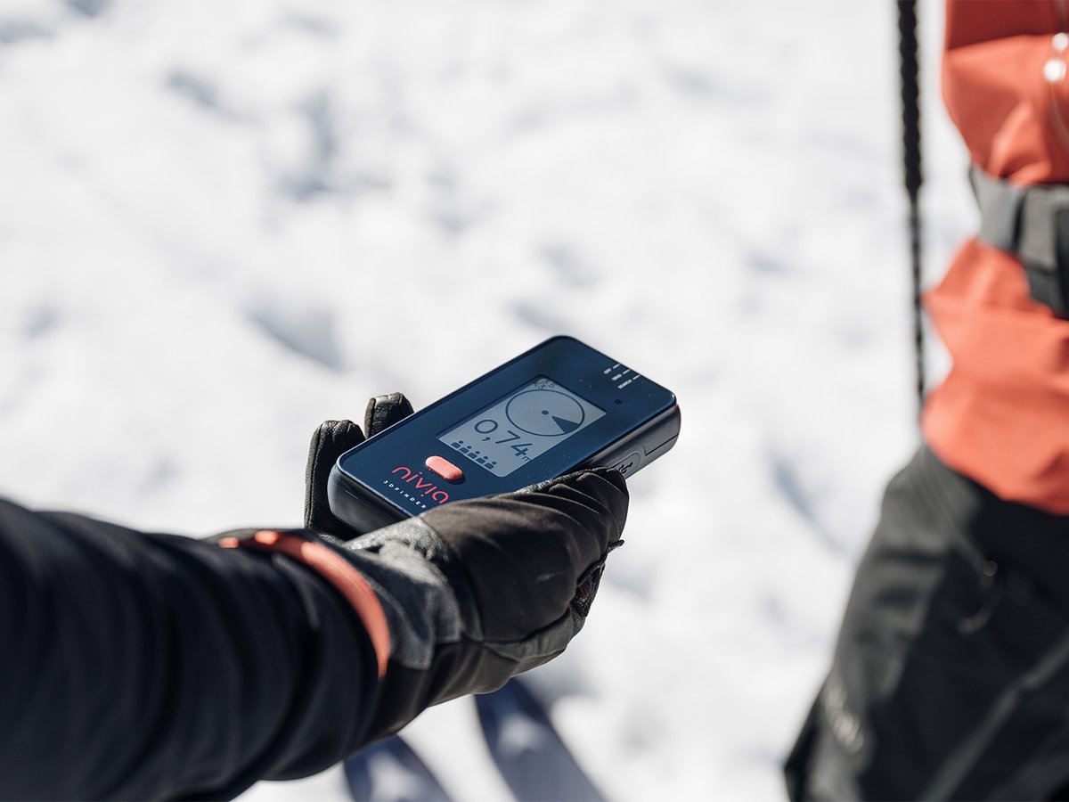 Gloved hand holding a Nivia 3D Finder during a fine search.